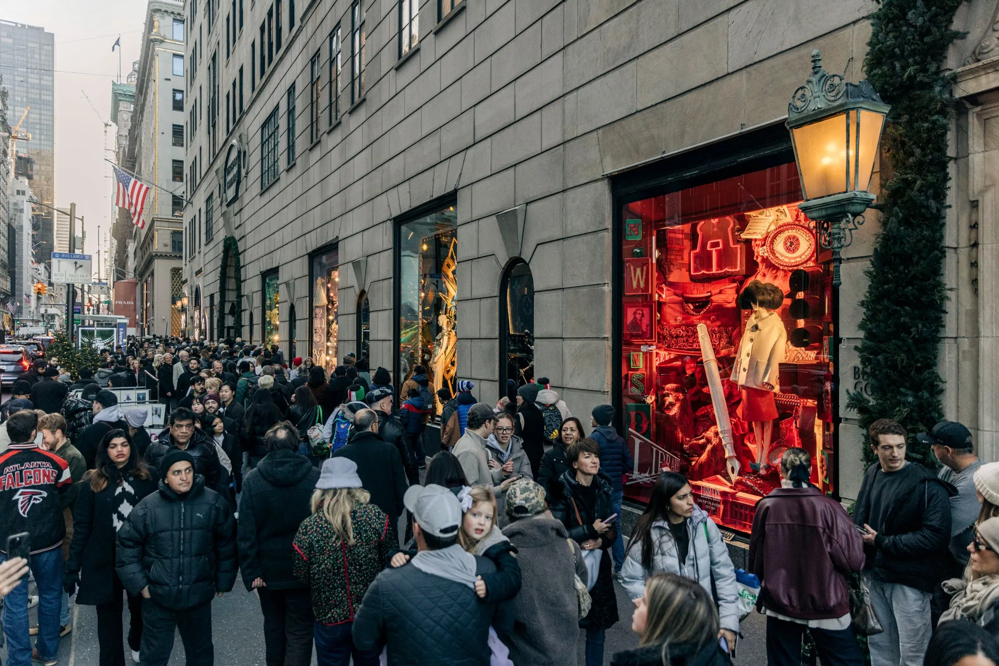 Pedestrians view holiday windows at the Bergdorf Goodman store on Fifth Avenue in New York in December 2024.&nbsp;