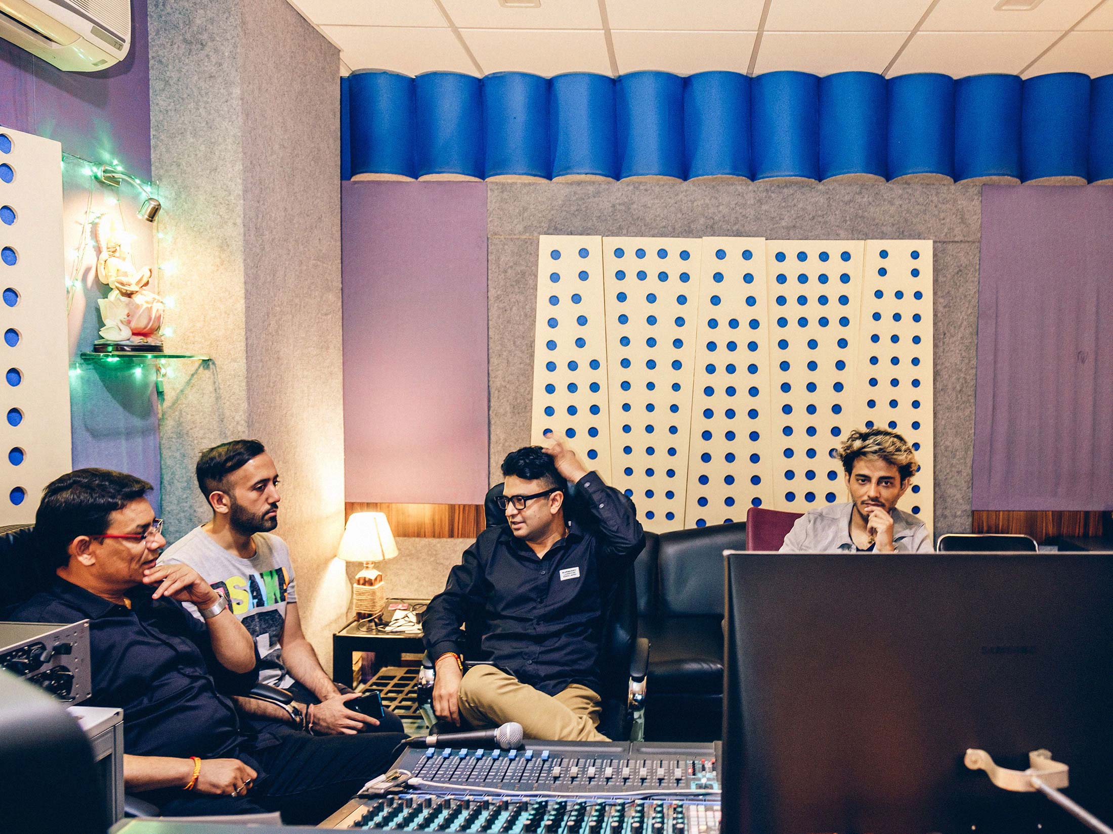 Bhushan Kumar (center), chairman and managing director for Super Cassettes Industries Ltd., also known as T-Series, with music composer and singer Tanishk Bagchi (right) and Neeraj Kalyan (left), president of T-Series, at a listening session&nbsp;in Mumbai on Sept.&nbsp;25.