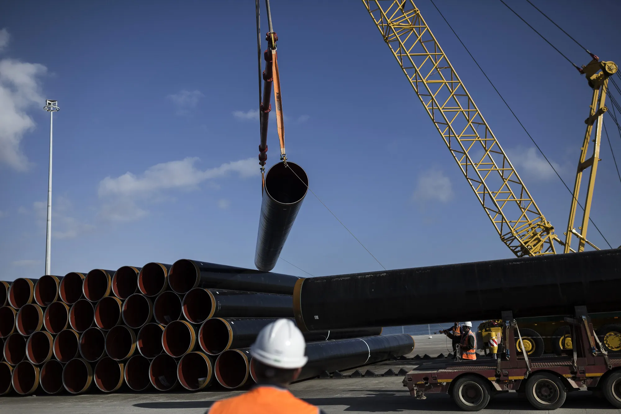 Gas Pipe is Loaded Onto a Truck