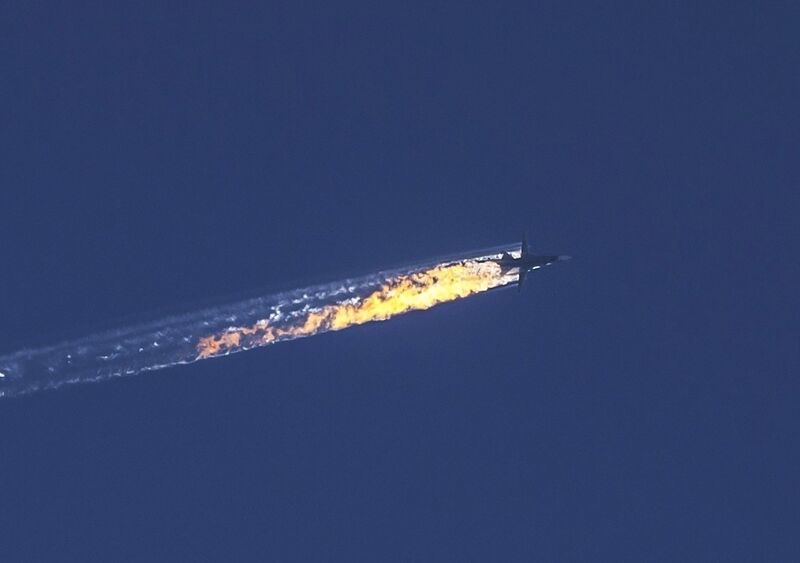 Russian warplane violating Turkish airspace is downed in Kizildag region of Turkey's Hatay province, close to the Syrian border, on November 24, 2015. A jet brought down after violating Turkish airspace was given 10 warnings over a five-minute period. (Photo by Fatih Aktas/Anadolu Agency/Getty Images)