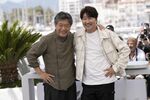 Director Hirokazu Koreeda, left, and Song Kang-ho pose for photographers at the photo call for the film 'Broker' at the 75th international film festival, Cannes, southern France, Friday, May 27, 2022. (Photo by Joel C Ryan/Invision/AP)