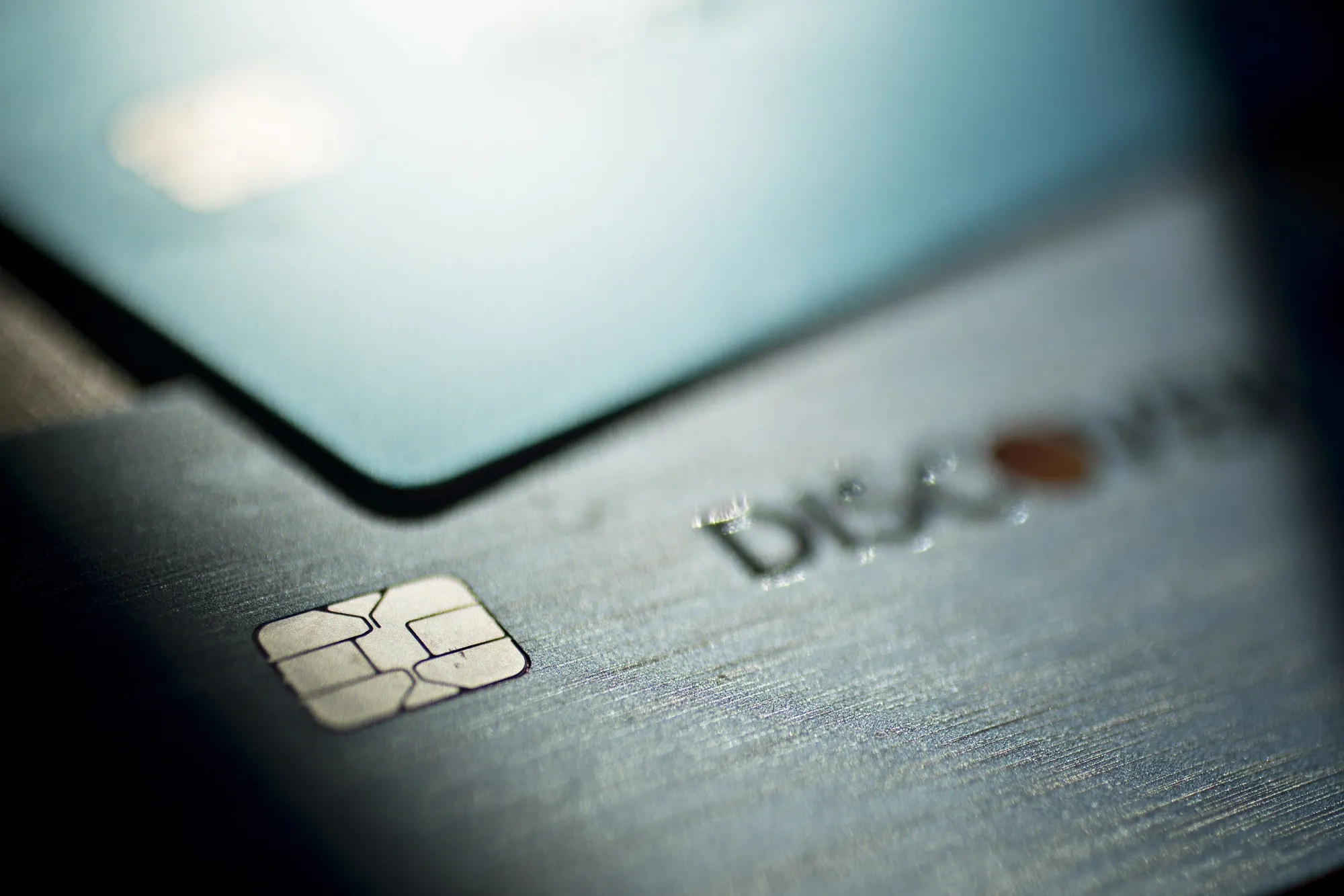 Discover Financial Services chip credit and debit cards are arranged for a photograph in Washington, D.C., U.S., on Friday, Oct. 20, 2017.