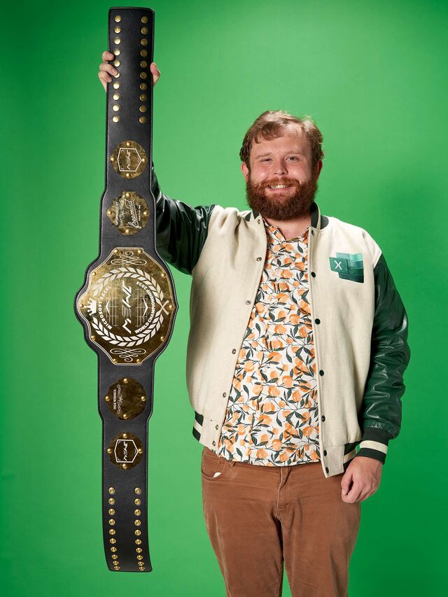Portrait of Michael Jarman holding the Microsoft World Champion belt