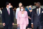 Nancy Pelosi, center, at Sungshan Airport in Taipei on Tuesday