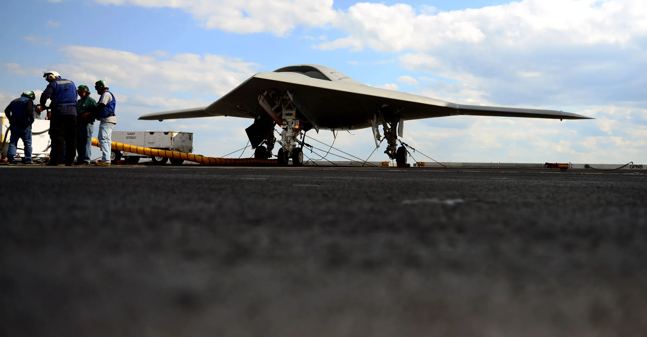 Northrop Grumman personnel conduct pre-operational tests Monday, May 13, 2013 on an X-47B Unmanned Combat Air System (UCAS) demonstrator on the flight deck of the aircraft carrier USS George H.W. Bush (CVN 77). George H.W. Bush is scheduled to be the first aircraft carrier to catapult launch an unmanned aircraft from its flight deck.
