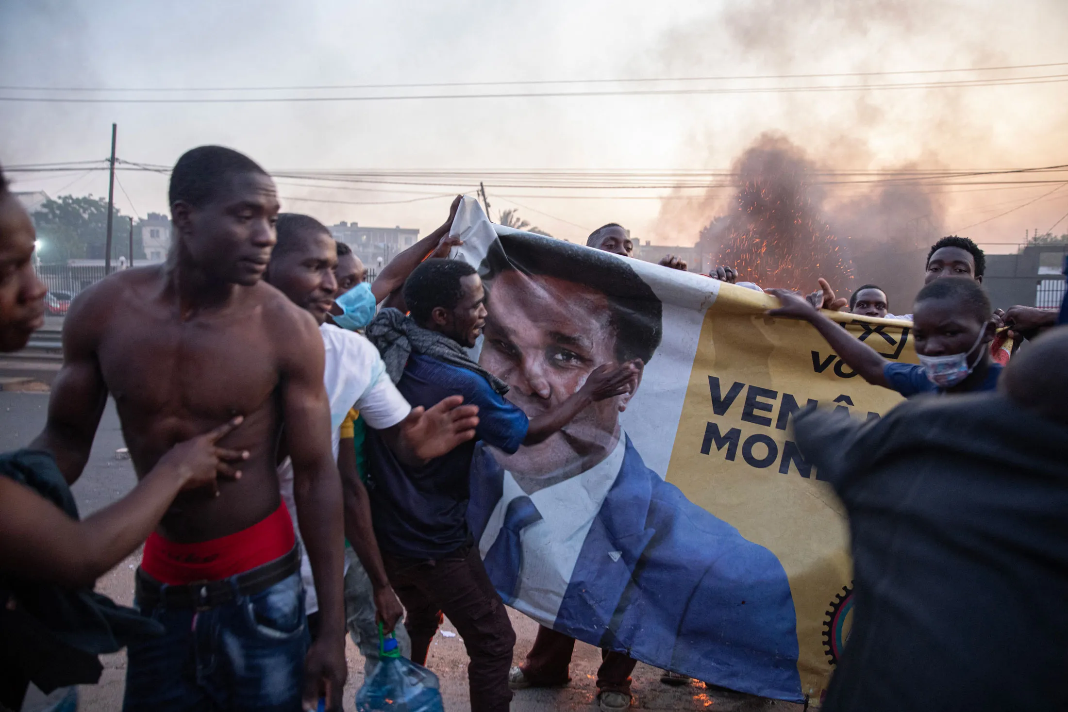 Protesters with a poster of opposition candidate Venâncio Mondlane, in Maputo, Mozambique, on Oct. 24.