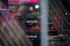 Monitors display stock market information at the Nasdaq MarketSite in the Times Square neighborhood of New York, U.S., on Monday, Dec. 17, 2018. Health-care and technology stocks pushed U.S. equity indexes lower as investors considered the impact of the Federal Reserve on growth in an economy already jittery over trade, political tensions and a possible government shutdown.