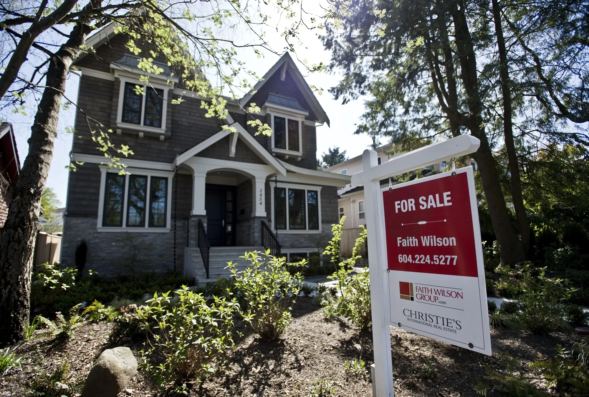 A "For Sale" sign&nbsp;outside a home in Vancouver, British Columbia.