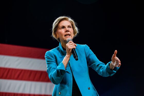 Warren Says Bloomberg Should Divest From His Company’s News Division