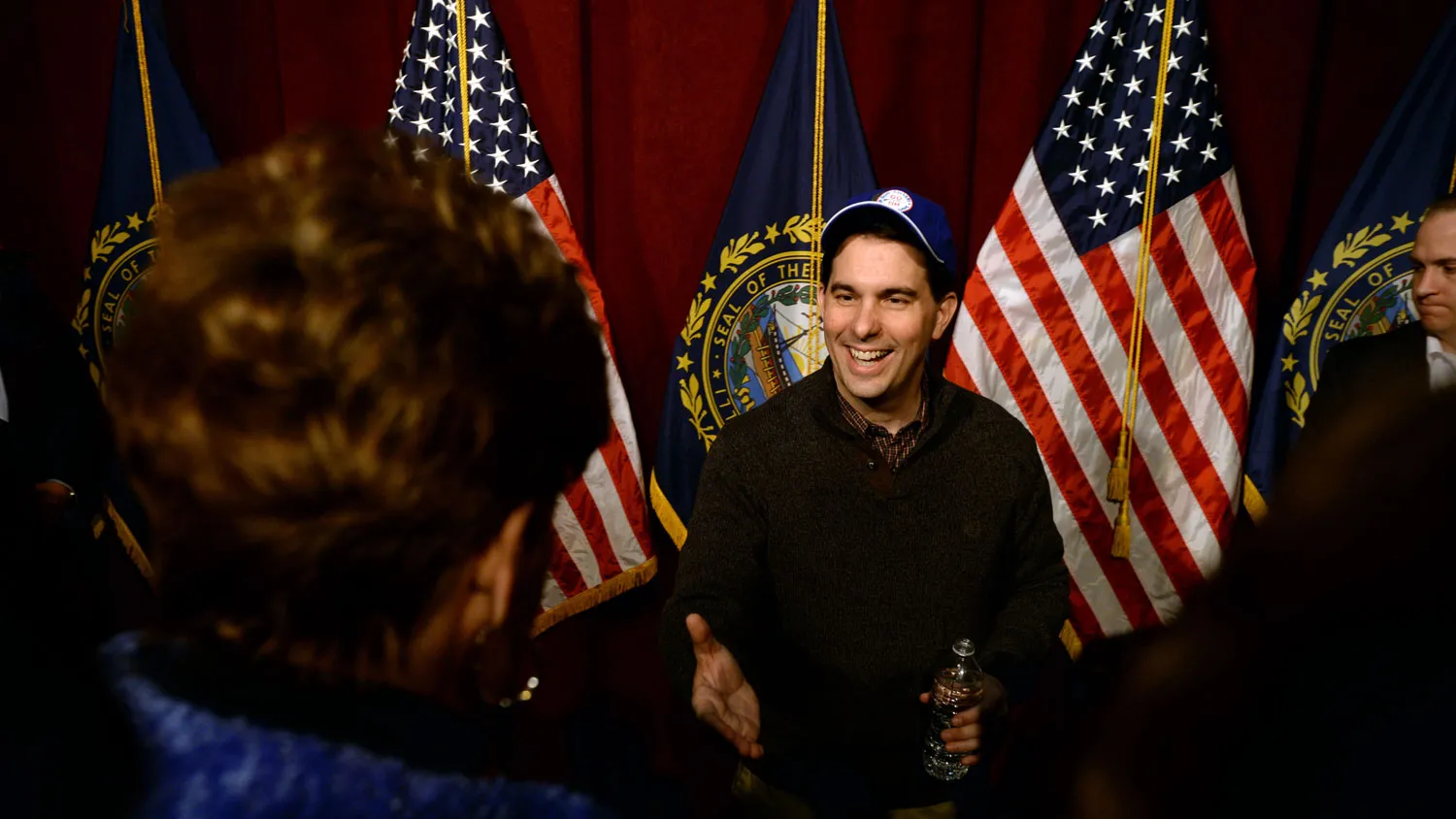 Wisconsin Governor Scott Walker shakes hands with people following a grassroots training and rally event at Concord High School March 14, 2015 in Concord, New Hampshire.
