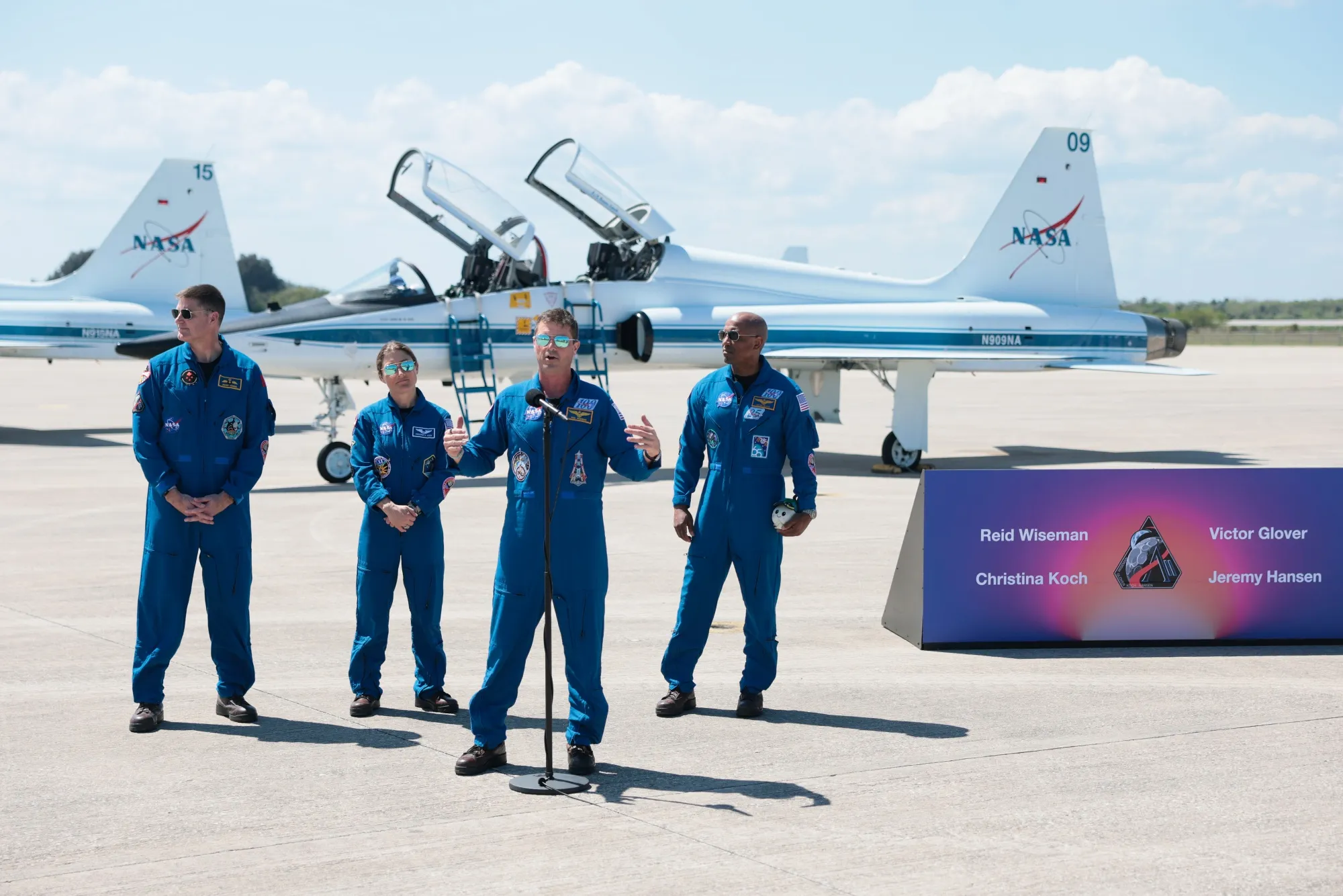 Artemis II crew commander Reid Wiseman, center, speaks as mission specialist Jeremy Hansen, from left, mission specialist Christina Koch and pilot Victor Glover look on after arriving at the Kennedy Space Center in Cape Canaveral, Florida on March 27.&nbsp;