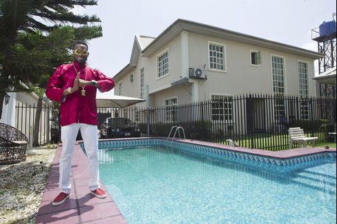 D'banj by the pool at home