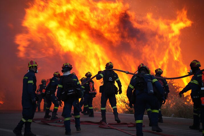 Firefighters tackle wildfires on the island of Xios, Greece, on June 22.