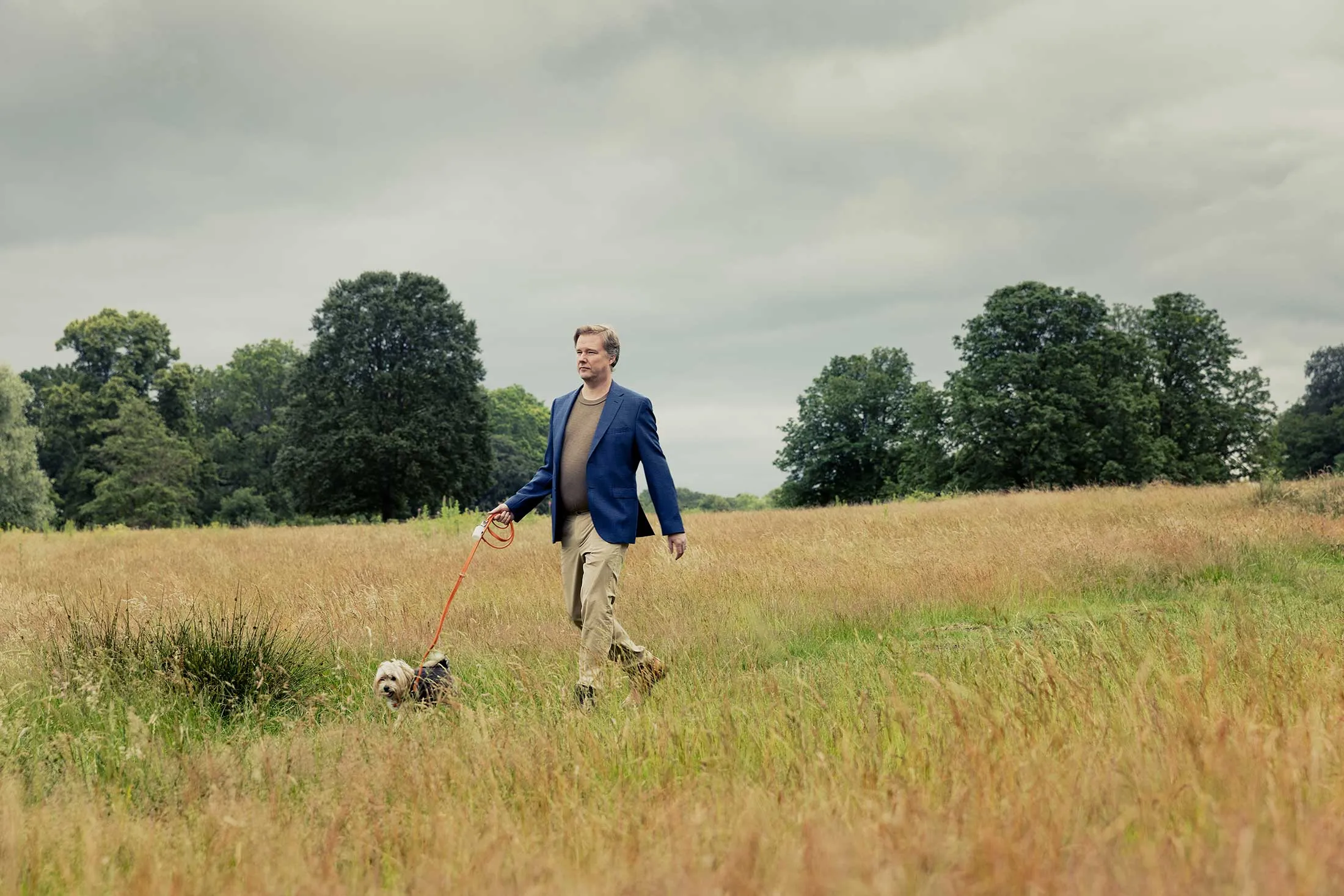Carbon trader Ulf Ek strolls through Richmond Park in London with Dollar, a Maltese-Yorkie mix.