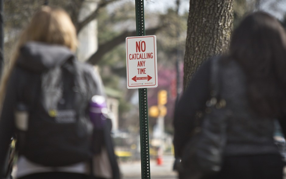 A &quot;No Catcalling Anytime&quot; sign, posted by the nonprofit Feminist Apparel, hangs in Brooklyn's Grand Plaza area in April 2015.