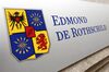 A sign sits outside Edmond de Rothschild (Suisse) S.A. in Geneva, Switzerland, on Friday, Oct. 16, 2015. Once bastions of secrecy, 41 Swiss banks signed amnesty agreements this year with the U.S. Justice Department that required disclosing the tricks they used to help customers hide assets, naming bankers and middlemen who enabled them and detailing the flow of untaxed money.