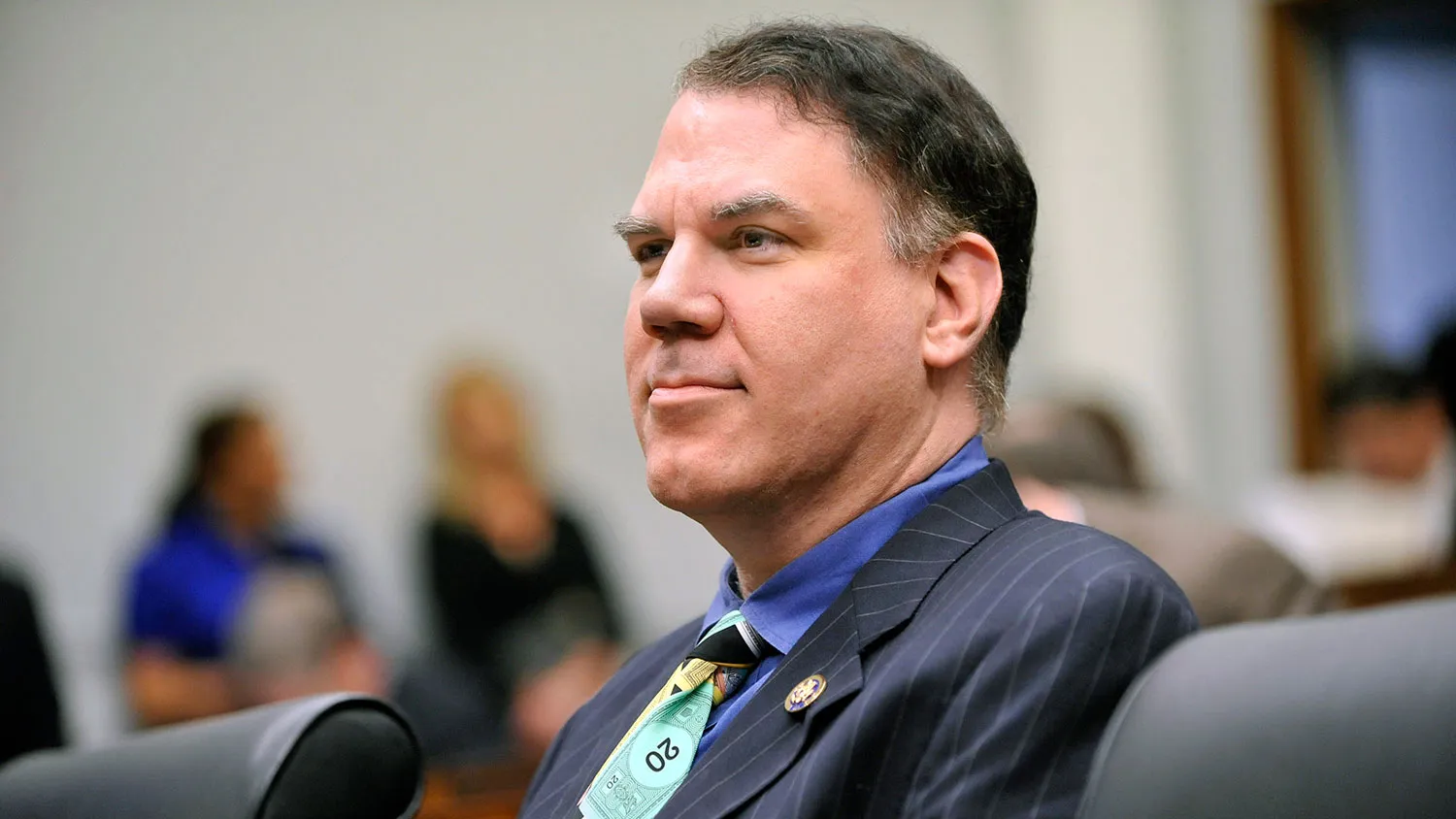Representative Alan Grayson, a Democrat from Florida, wears a tie made of play money as he waits to question Federal Reserve Chairman Ben S. Bernanke during a House Financial Services Committee hearing in Washington on Oct. 1, 2009.
