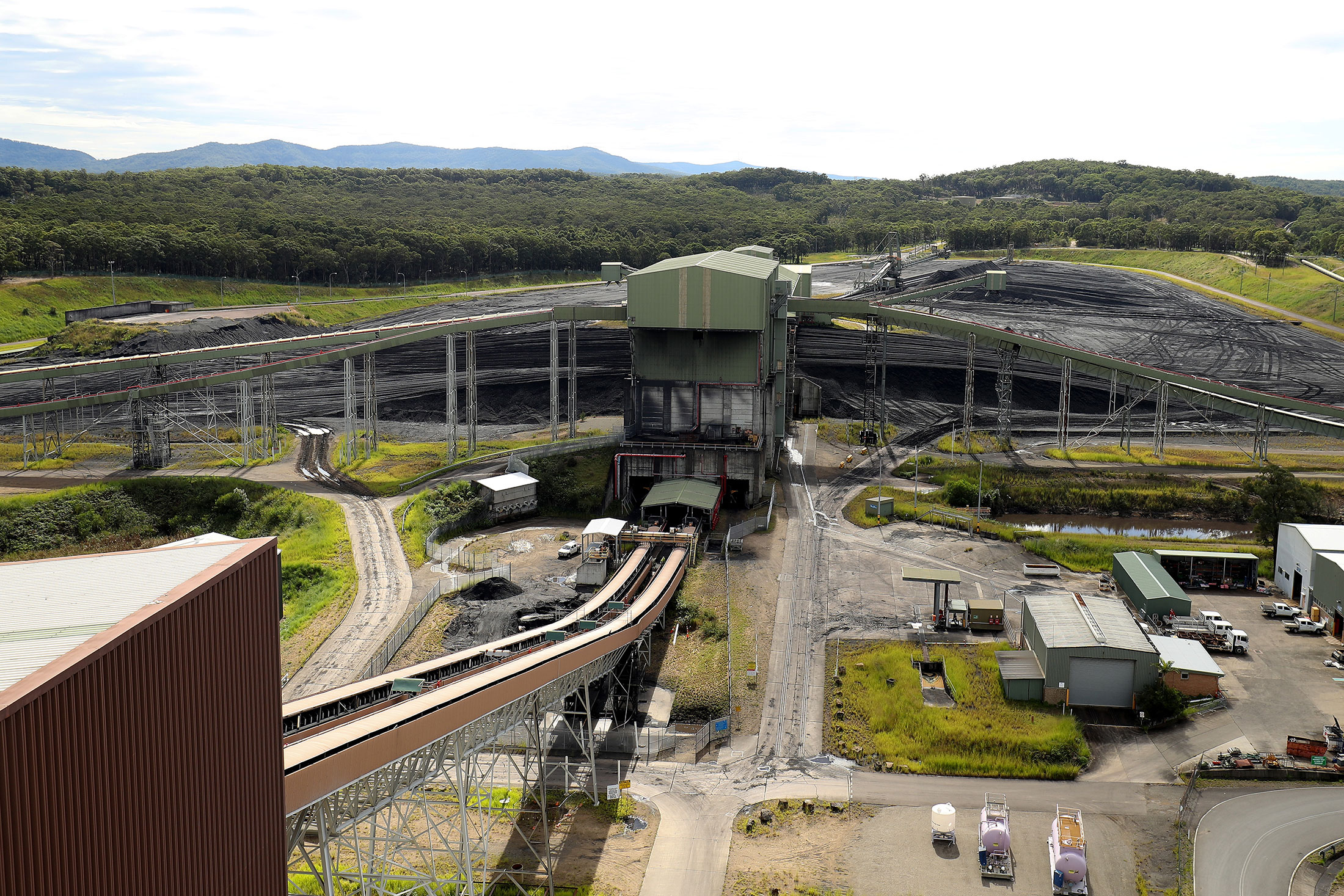 A stacker-reclaimer next to a stockpile of coal at Eraring Power Station, in Eraring, Australia, on Thursday, April 28, 2022.