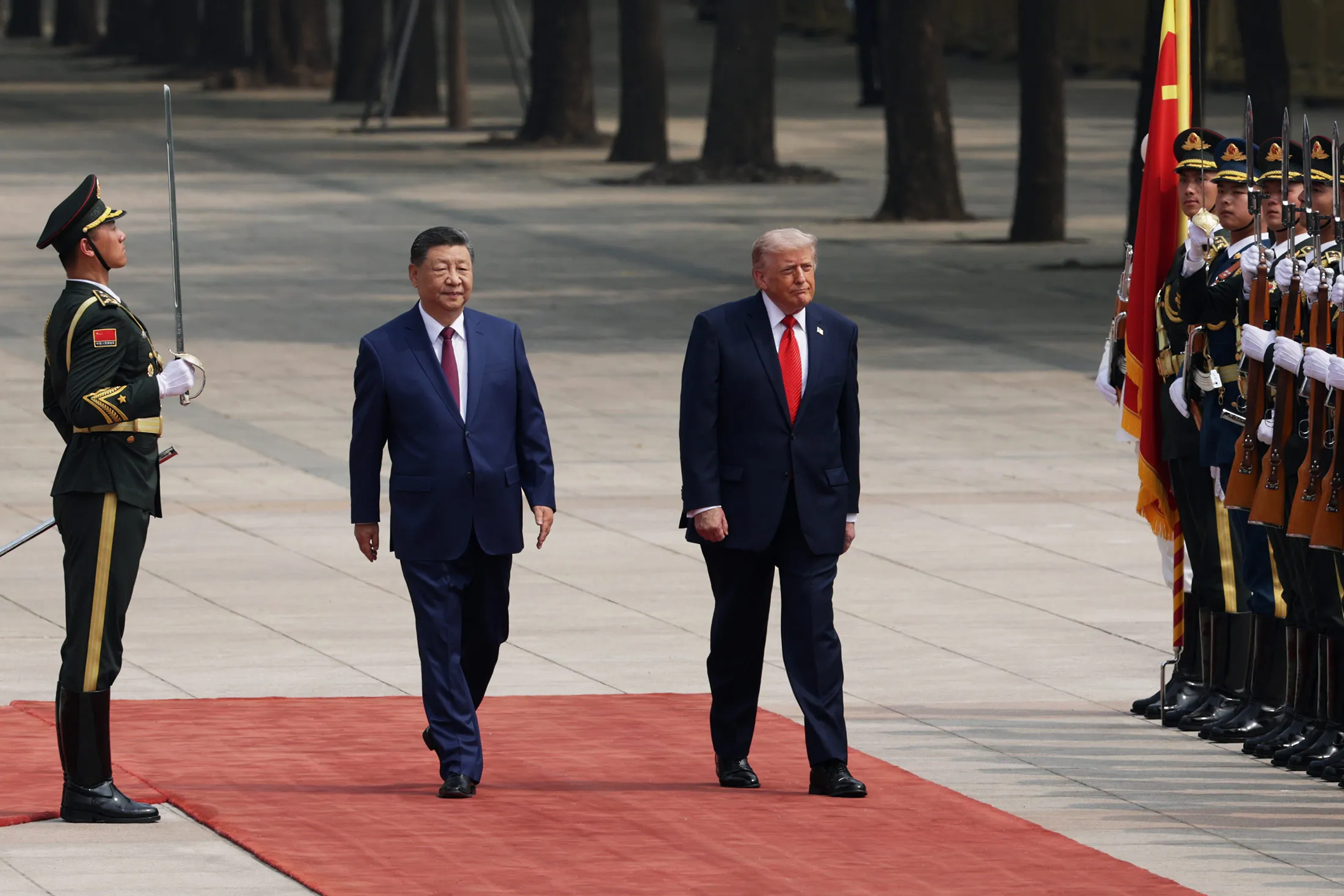 US President Donald Trump reviews an honor guard with Chinese President Xi Jinping during a welcome ceremony in Beijing on&nbsp;May 14.