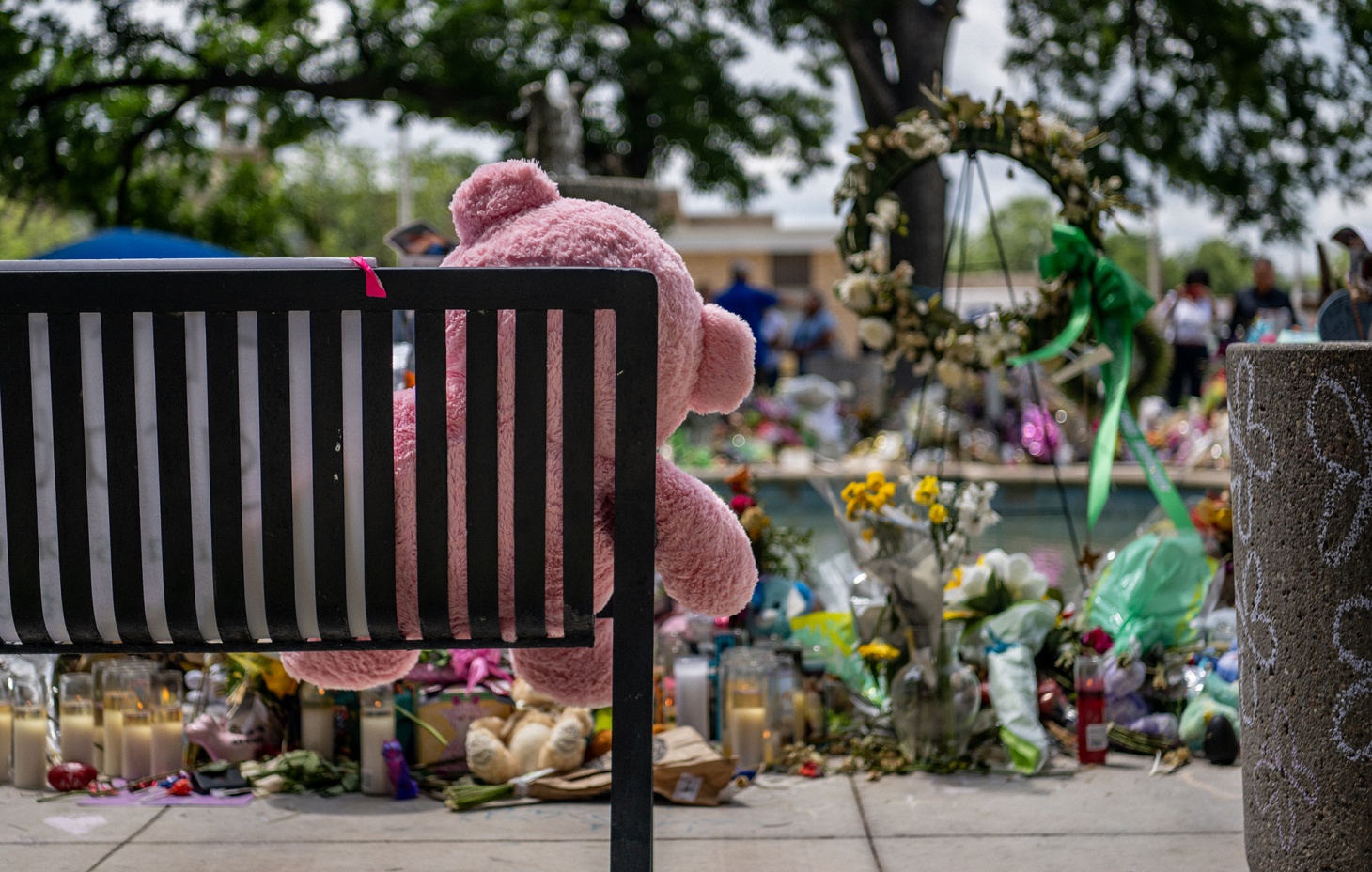 A teddy bear on a bench at a memorial dedicated to those murdered on May 24 during the mass shooting at Robb Elementary School, in Uvalde, Texas