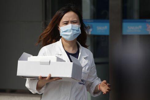 A hospital worker at a quarantine tent