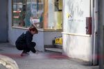 A German police investigator works outside &quot;La votre&quot; cafe bar, that was targeted in a shooting at the Heumarkt in the centre of Hanau, on Feb. 21.