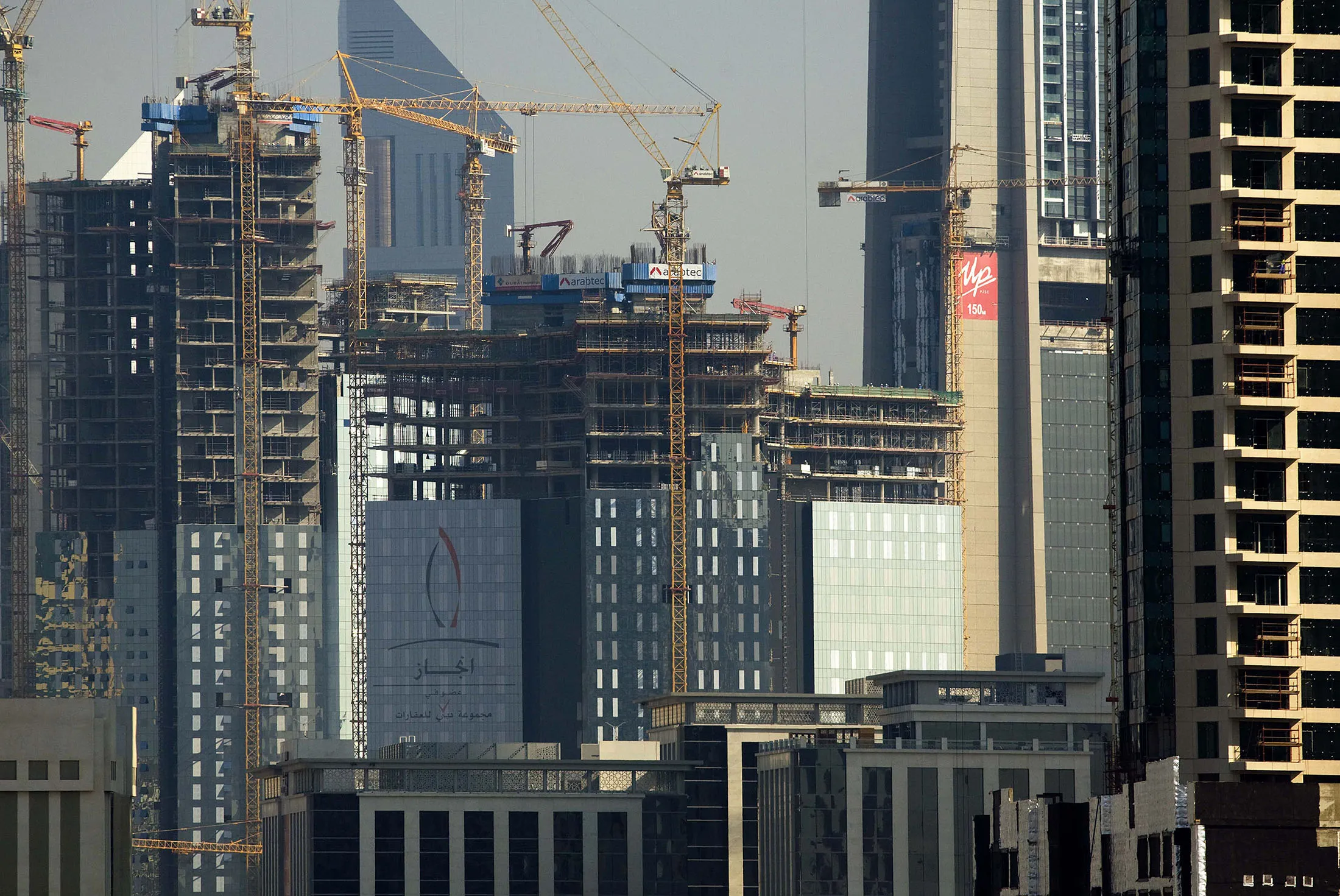 Cranes tower over buildings under construction in Dubai, United Arab Emirates, on Nov. 23, 2008.
