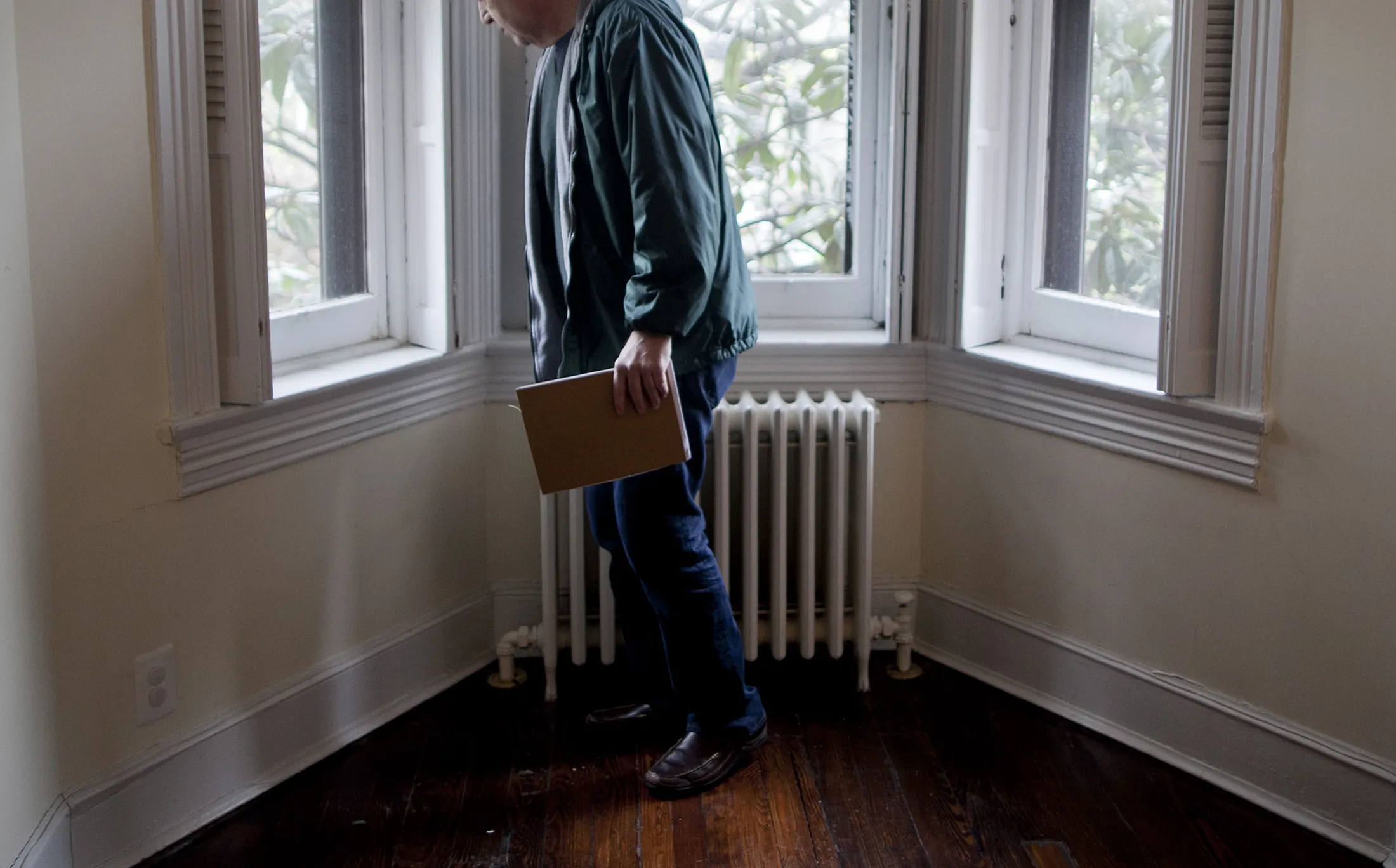 A potential homebuyer walks through a five-bedroom house for sale in Washington, D.C.
