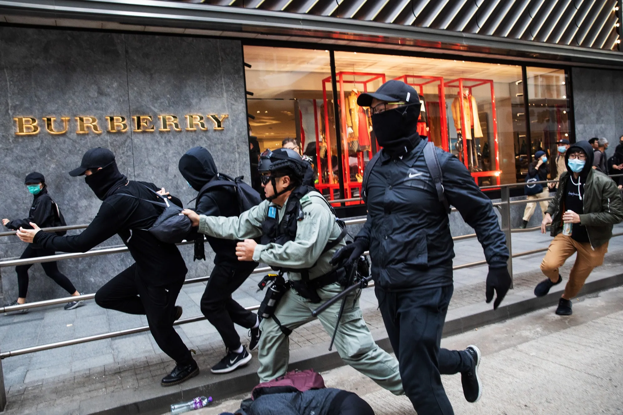 Riot police charge and attempt to detain demonstrators during a protest in Hong Kong, in Jan. 2020.