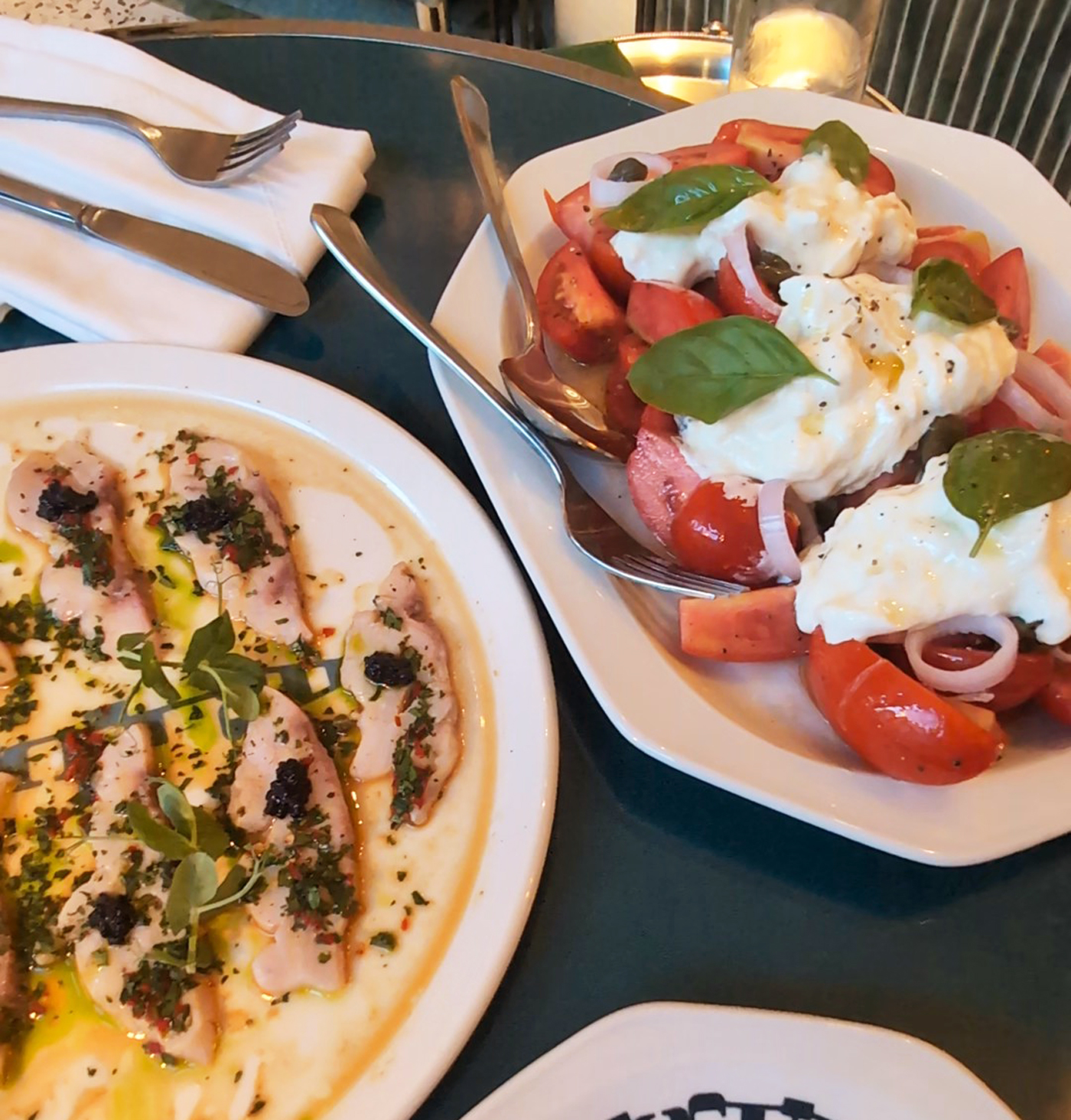 Sea bass carpaccio and burrata feature at Arlecchino. Source: Andre-Pierre du Plessis/Bloomberg