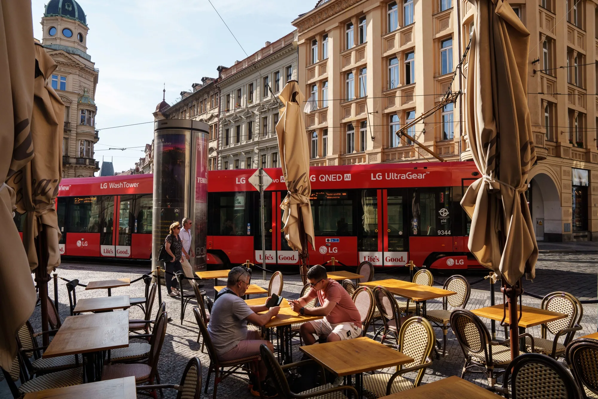 Customers sitting at a cafe in Prague.