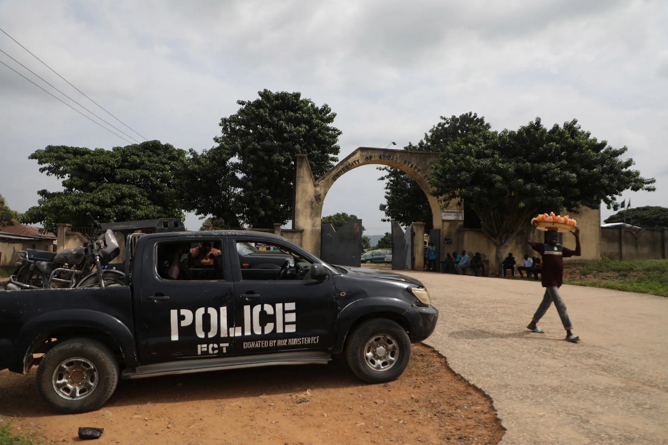 A police truck stationed outside the University of Abuja Staff Quarters gate where unknown gunmen kidnapped people on Nov.&nbsp;2, 2021.&nbsp;