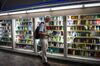 A customer holds cleaning products while shopping at a drug store in the Nakano district of Tokyo Japan.