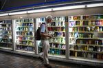 A customer holds cleaning products while shopping at a drug store in the Nakano district of Tokyo Japan.