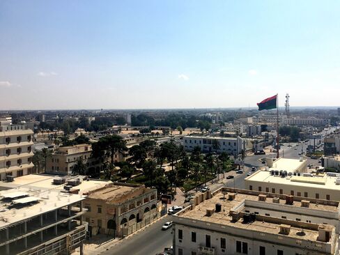 A Libyan national flag flies over Tripoli Street in Misrata, Libya.