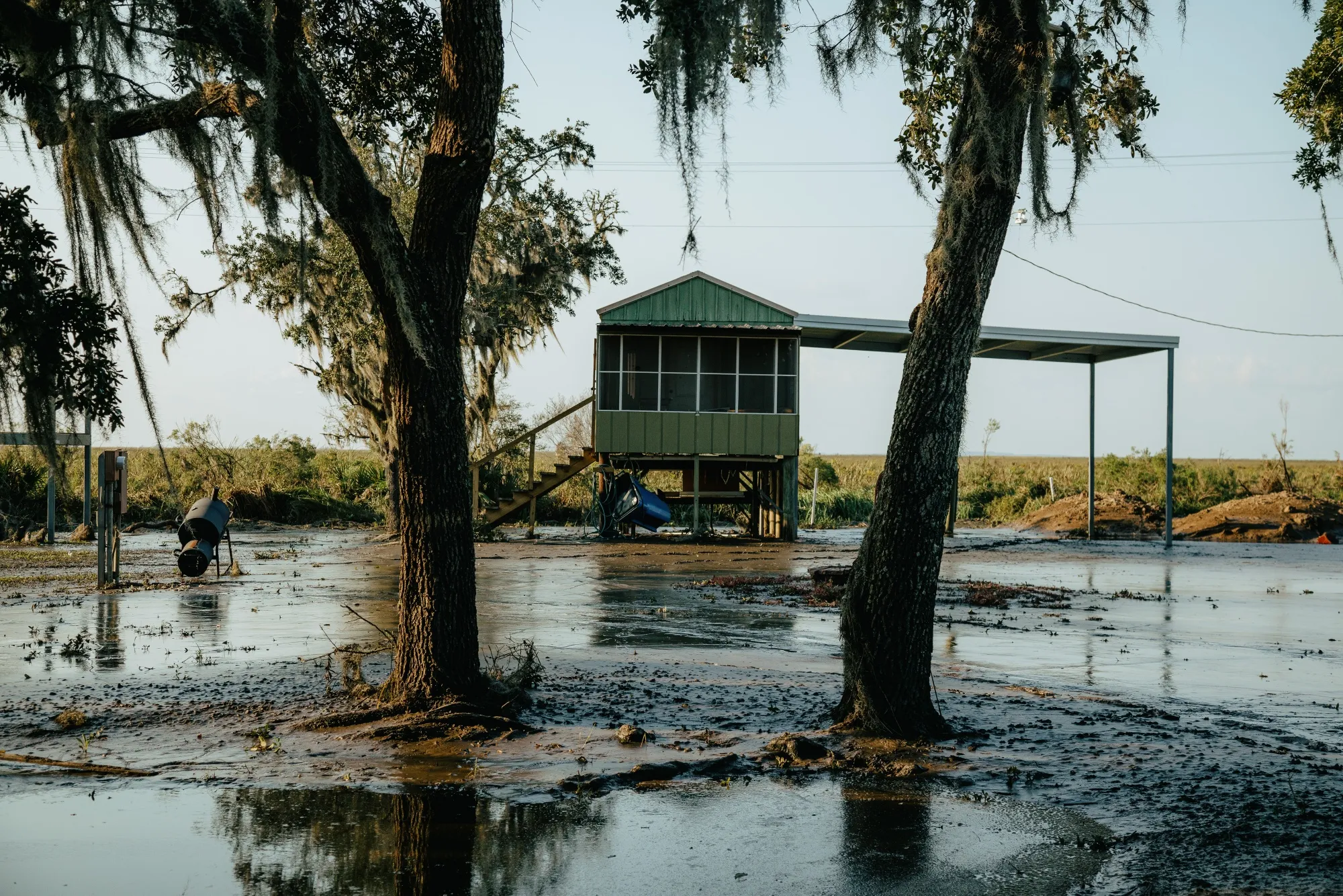 Mud outside a house after Hurricane Delta made landfall in Cypremort Point, Louisiana, U.S., on Oct. 11, 2020. Delta weakened to a tropical depression as it moved inland over northeastern Louisiana, knocking out power lines and drenching an area that was still recovering from the onslaught of Hurricane Laura.