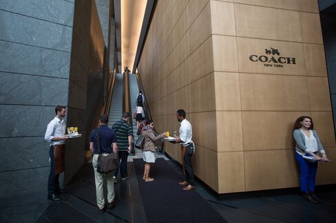 Guests arrive for the opening of Coach’s new offices.