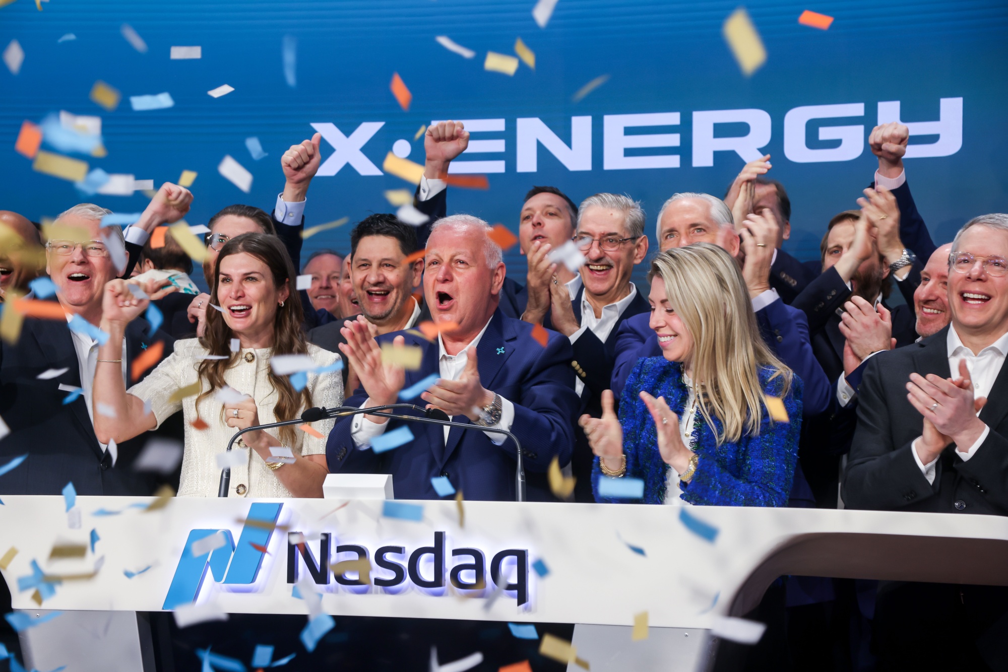 Kam Ghaffarian, founder and chairman of X-Energy, center, rings the opening bell during the company's initial public offering (IPO) at the Nasdaq MarketSite in New York, US, on Friday, April 24, 2026. X-Energy Inc., a nuclear energy firm that counts Amazon.com Inc. as a backer, raised $1.02 billion in an upsized US initial public offering that priced above the marketed range. Photographer: Michael Nagle/Bloomberg