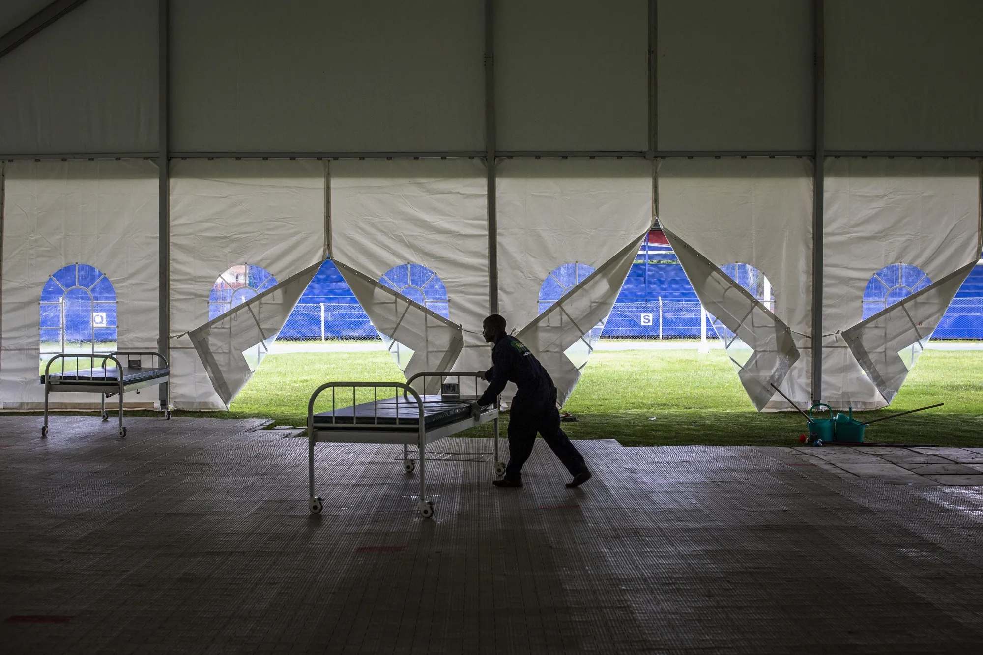 A worker pushes a trolley bed into position at the Machakos County Field Hospital near Nairobi, Kenya, on May 4.&nbsp;
