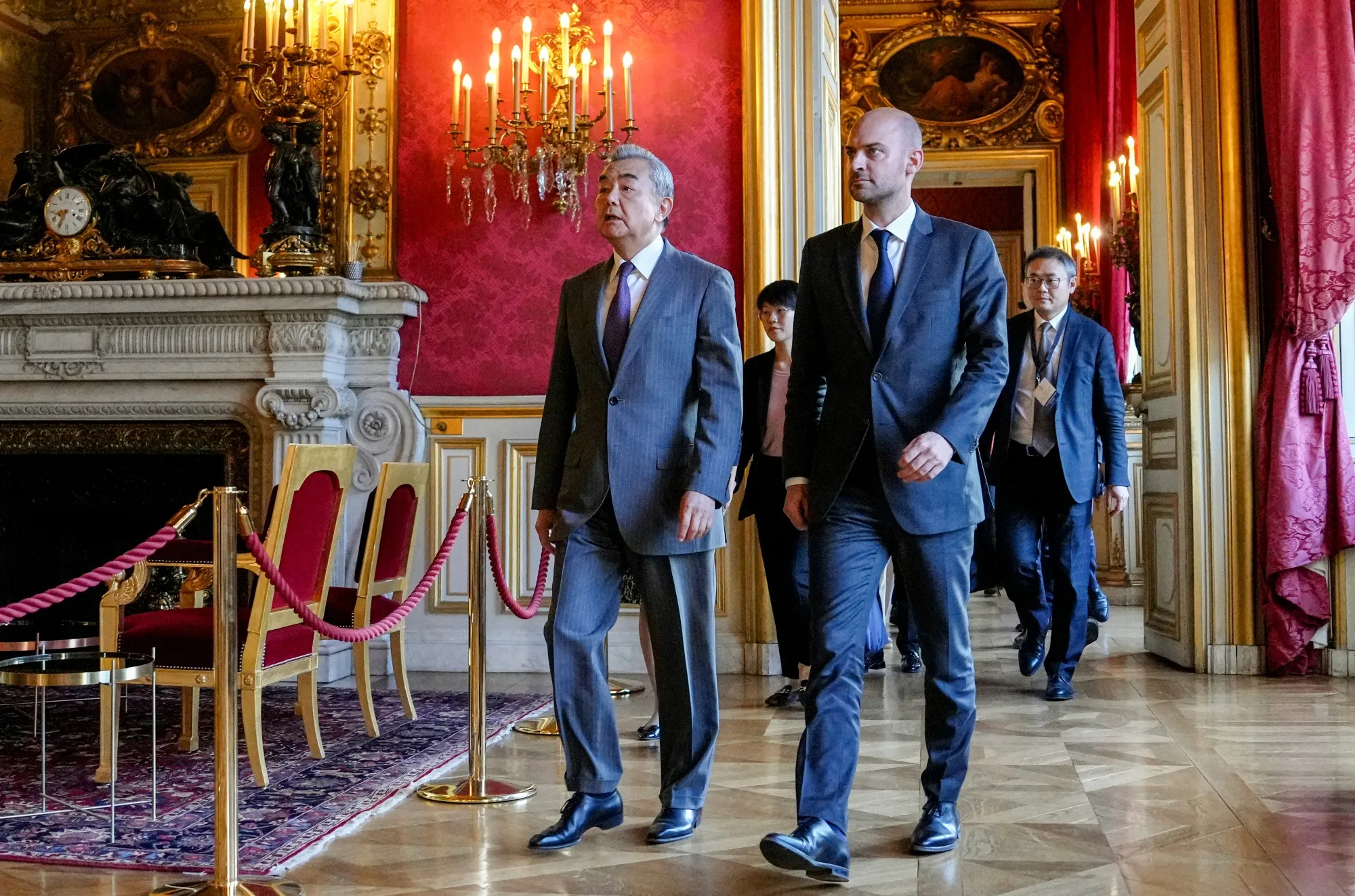 Jean-Noel Barrot, right, and Wang Yi arrive for a news conference in Paris on July 4.