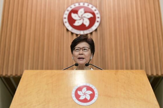 Carrie Lam Says Sanctions Won’t Help Hong Kong as Joshua Wong Meets Congress