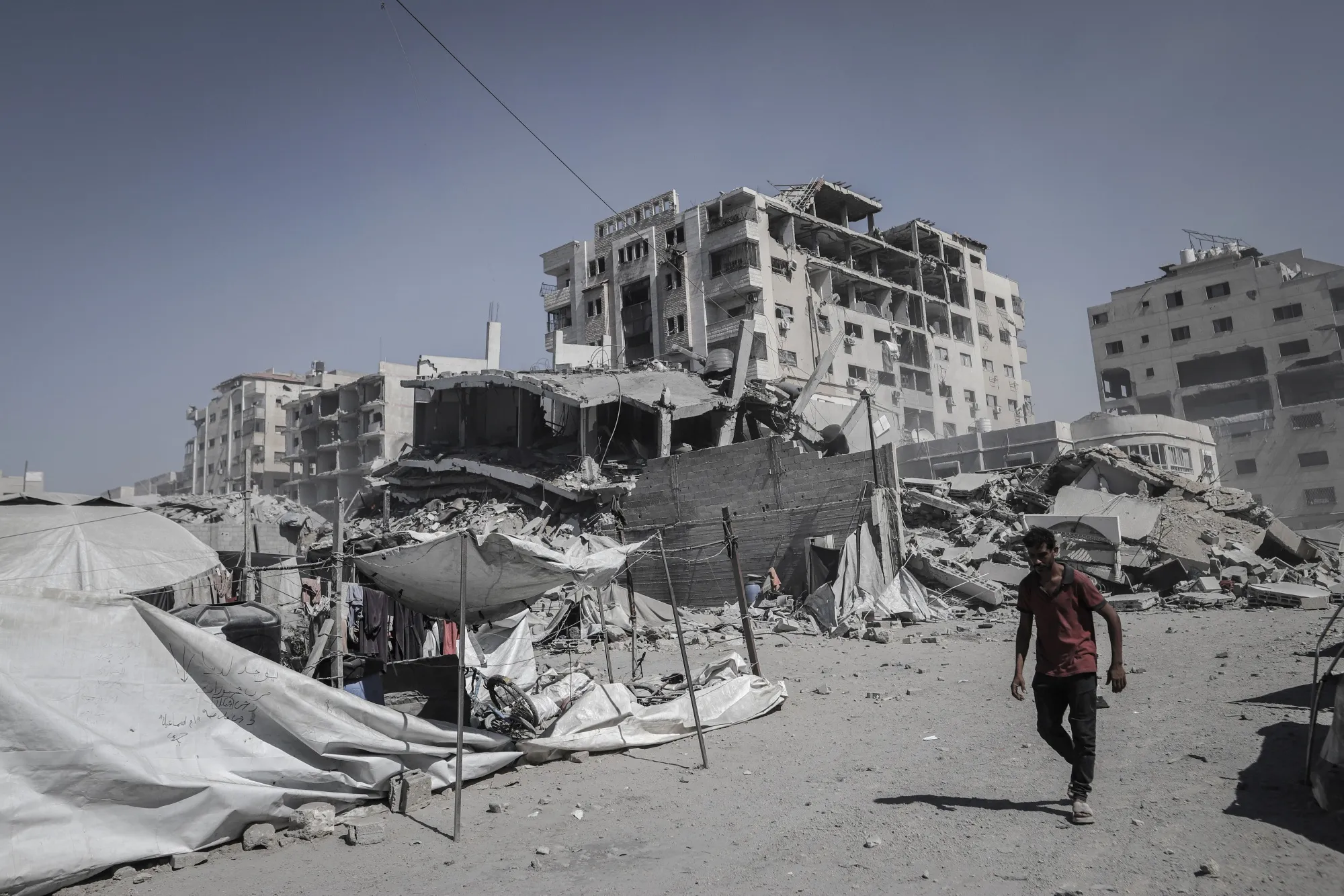 Temporary shelters near damaged buildings in Gaza City, Gaza.