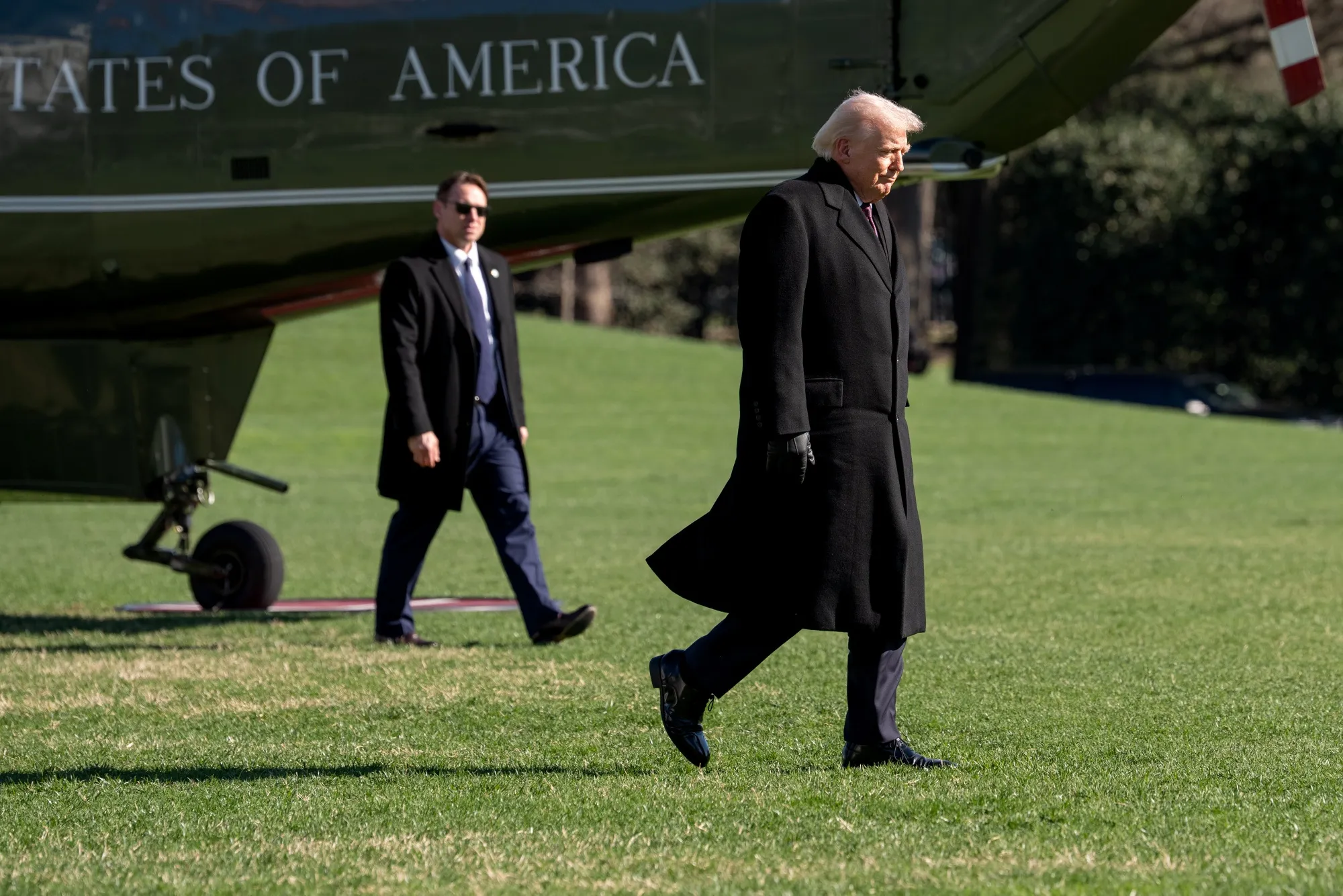 US President Donald Trump walks on the South Lawn of the White House.