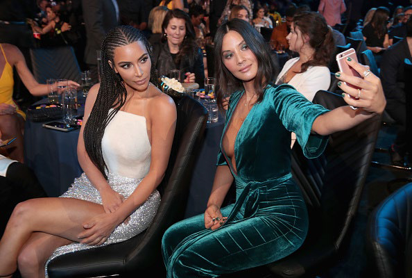 Kim Kardashian and friend taking selfie