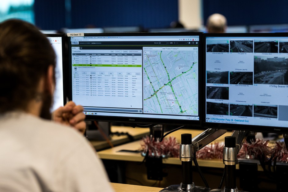 An INRIX editor monitors traffic in its command center.