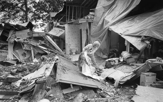 A resident salvages a few items from her home after it was destroyed during Hurricane Hugo in Hemby Bridge, North Carolina, on Sept. 29, 1989.