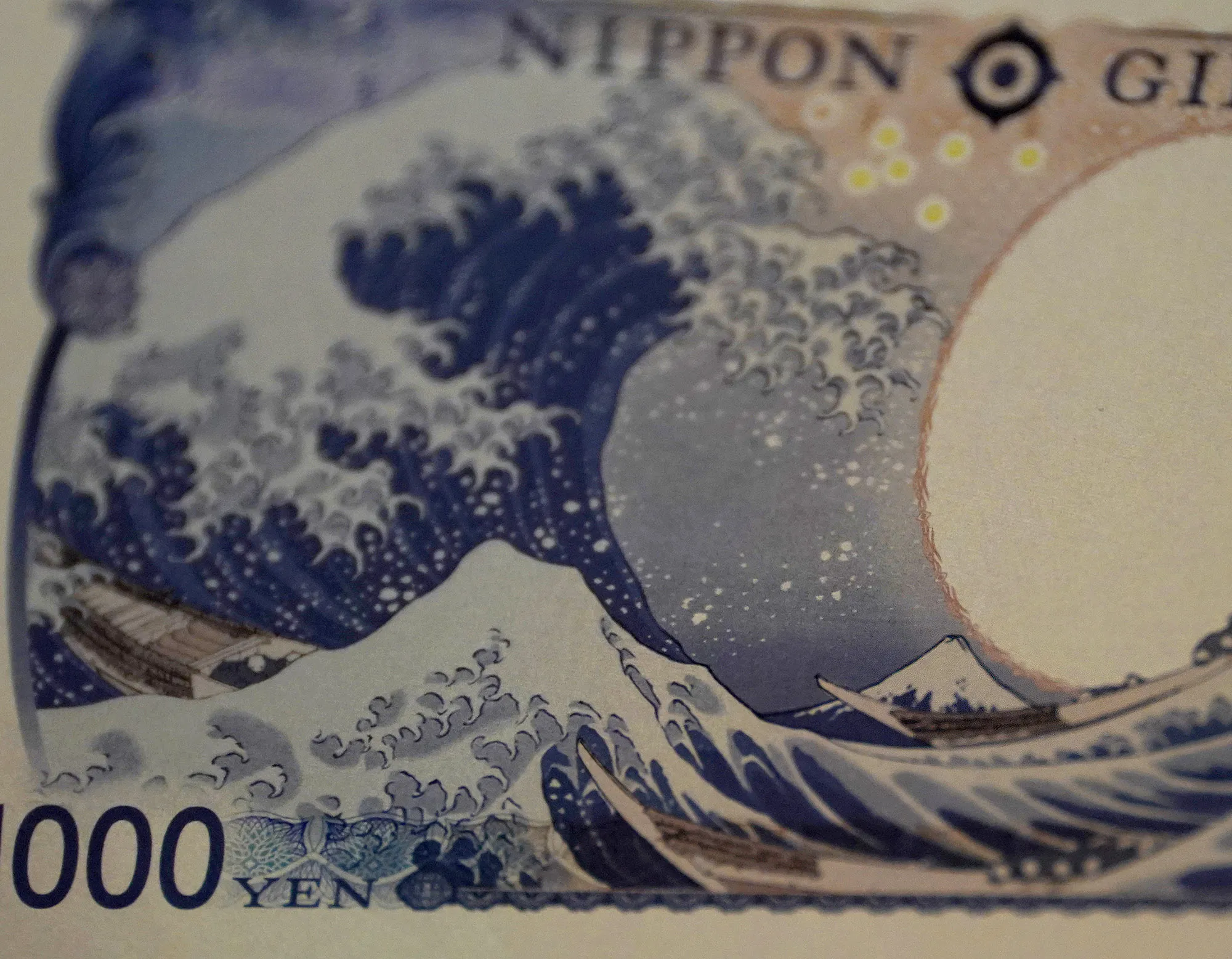 A section of a newly designed Japanese 1,000 yen banknote is displayed at a Japan Finance Ministry office in Tokyo.