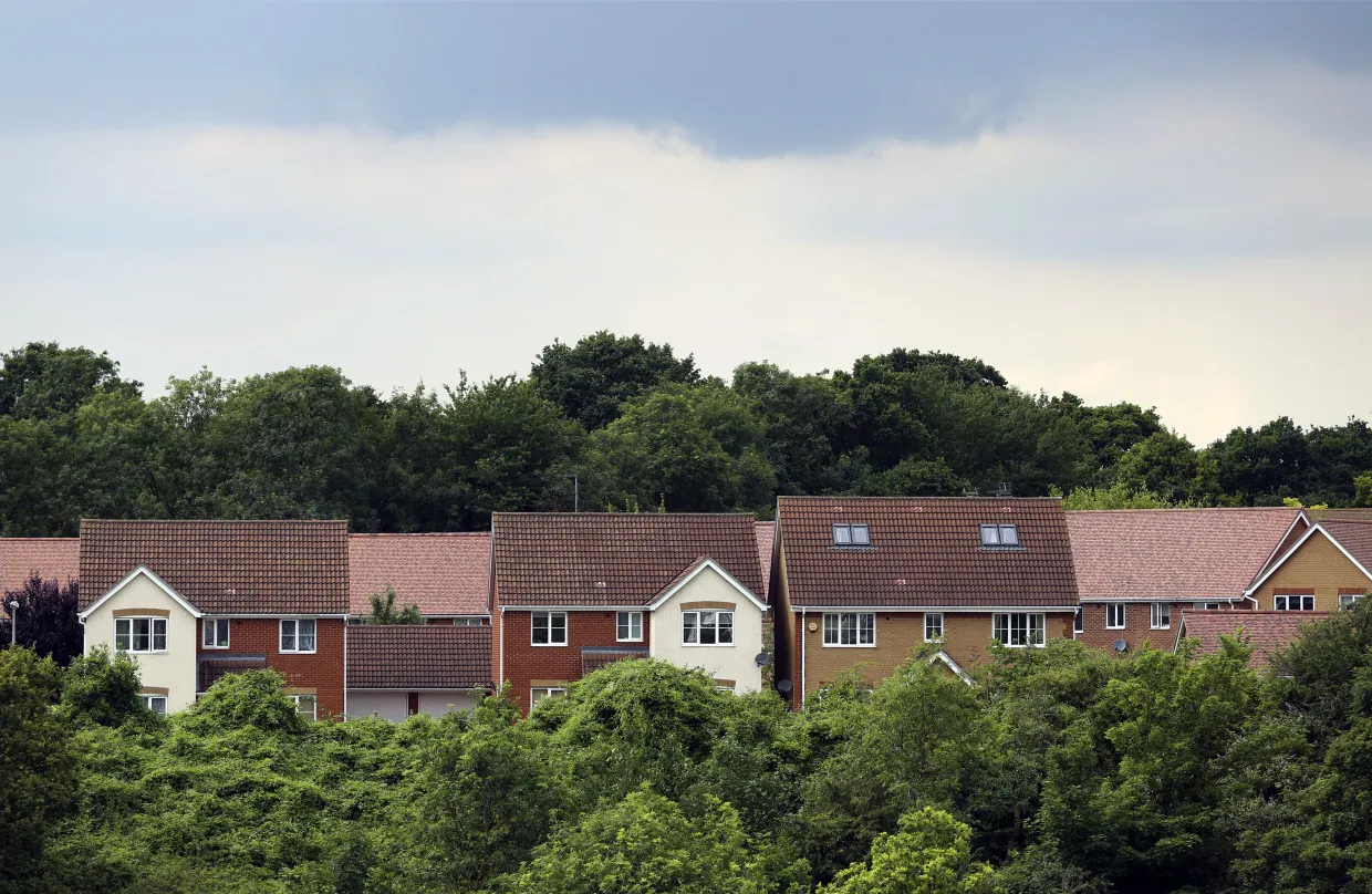 Rows of houses are seen between trees&nbsp;in Chafford Hundred.