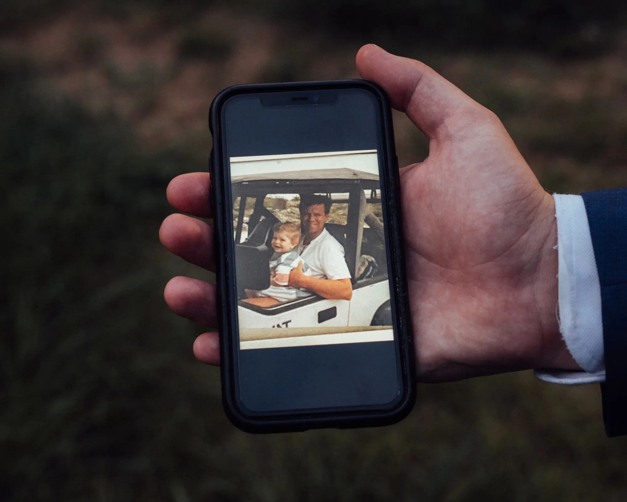 Evan Lozier holds a photograph of his father, Garry Lozier, who died at 47 while working at Sandler O’Neill &amp; Partners on the 104th floor of the World Trade Center on Sept. 11.
