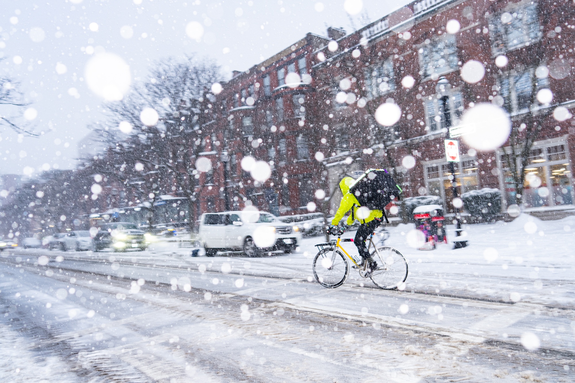 A delivery worker rides a bike during a winter storm in Boston, Massachusetts, US, on Sunday, Jan. 25, 2026. A massive winter storm reached the US Atlantic Coast on Sunday, bringing heavy snow and ice, straining electric grids and grounding thousands of flights at levels not seen since the pandemic. Photographer: Mel Musto/Bloomberg